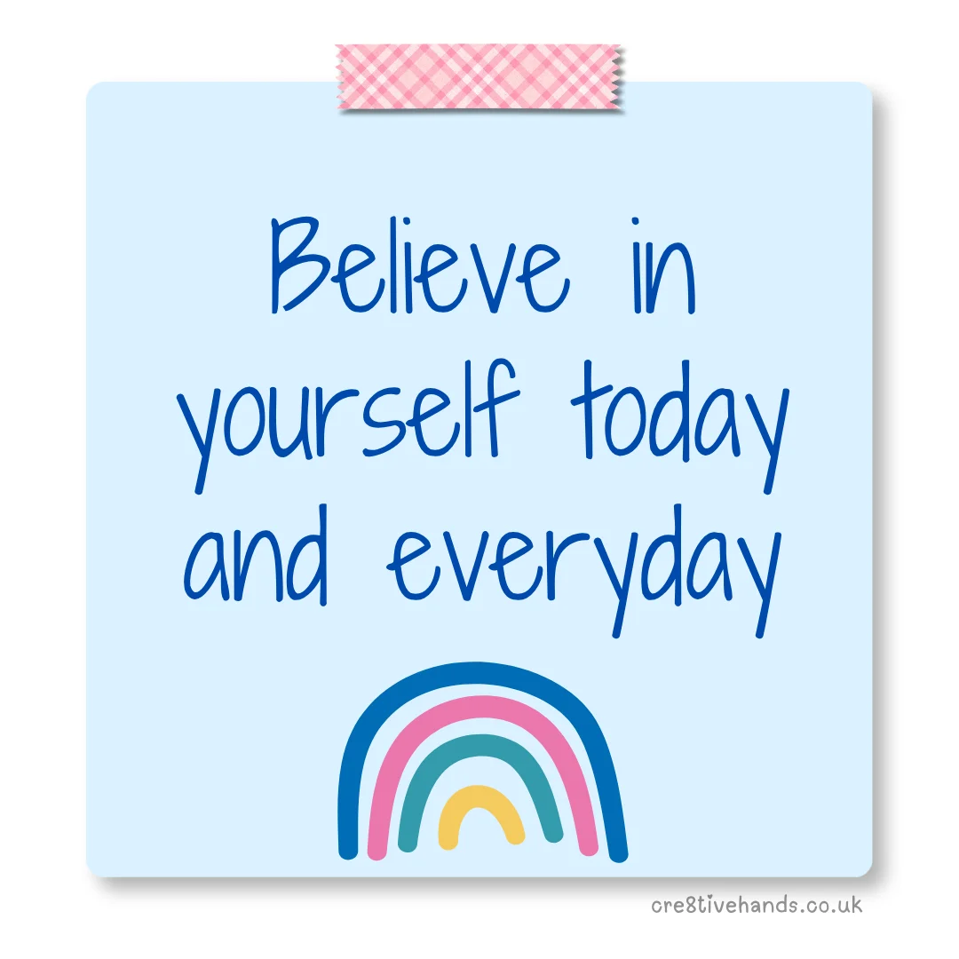 Pastel blue sticky note with the message “Believe in yourself today and everyday” with pink patterned tape and a colourful rainbow doodle.