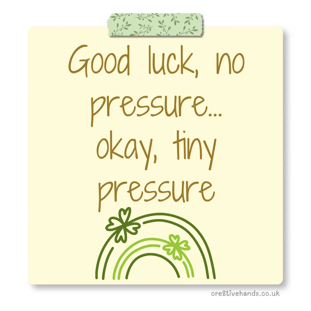 Pastel yellow sticky note with the message “Good luck, no pressure… okay, tiny pressure” with green floral tape and green rainbow clover doodles.