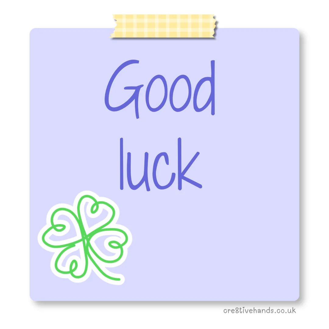 Pastel purple sticky note with the message “Good luck” with yellow gingham tape and a green four-leaf clover doodle.