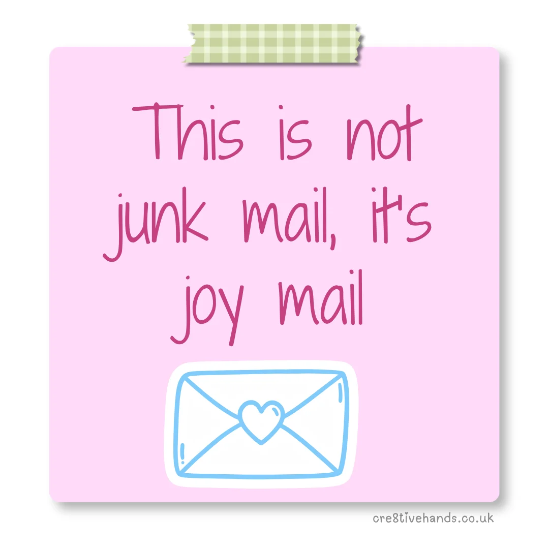 Pastel pink sticky note with the message “This is not junk mail, it’s joy mail” with green gingham tape and an envelope doodle.