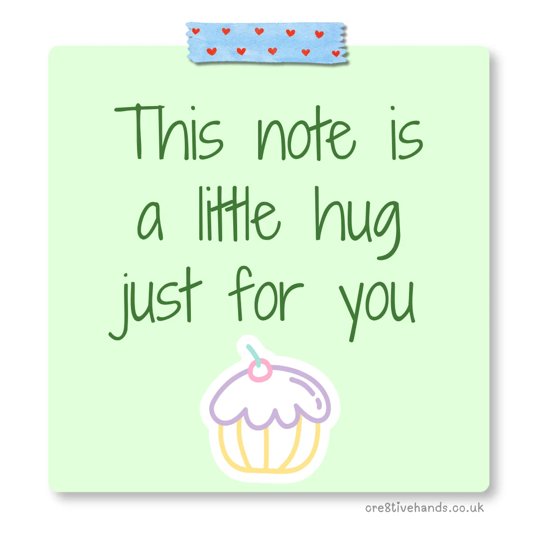 Pastel green sticky note with the message “This note is a little hug just for you” with blue heart tape and a cupcake doodle.